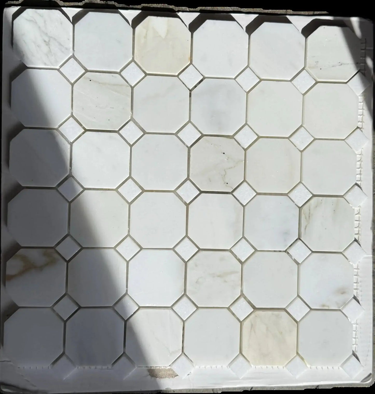 12x12 Tuscan Calacatta Gold Octagon Mosaic Tile showcasing luxury white marble with gold and grey veining.