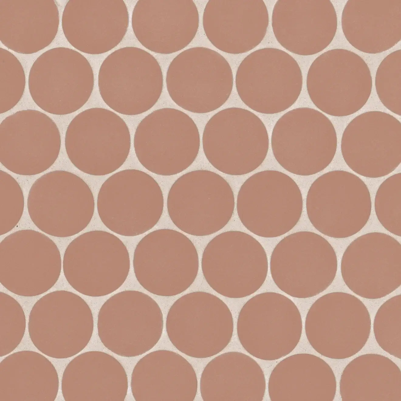 Makoto 2" round matte porcelain mosaic tile in Umi Terracotta, showcasing a circular pattern in earthy terracotta tones.