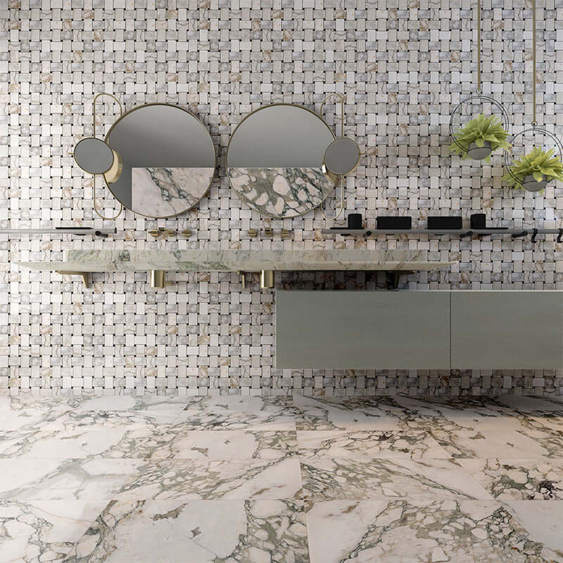 Stylish bathroom featuring Jumbo Calaverde Calacatta Green Honed Basketweave Marble Mosaic with modern decor and mirrors.