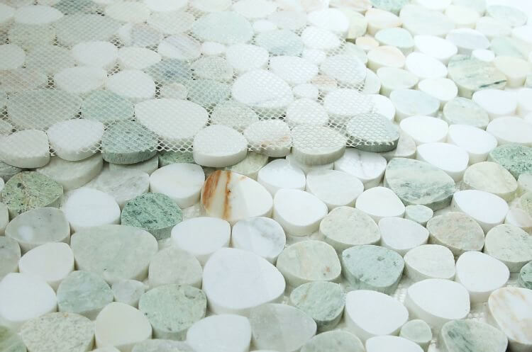 Aphrodite Spring 12x12 pebble-shaped marble mosaic made from white and green Onyx and marble.