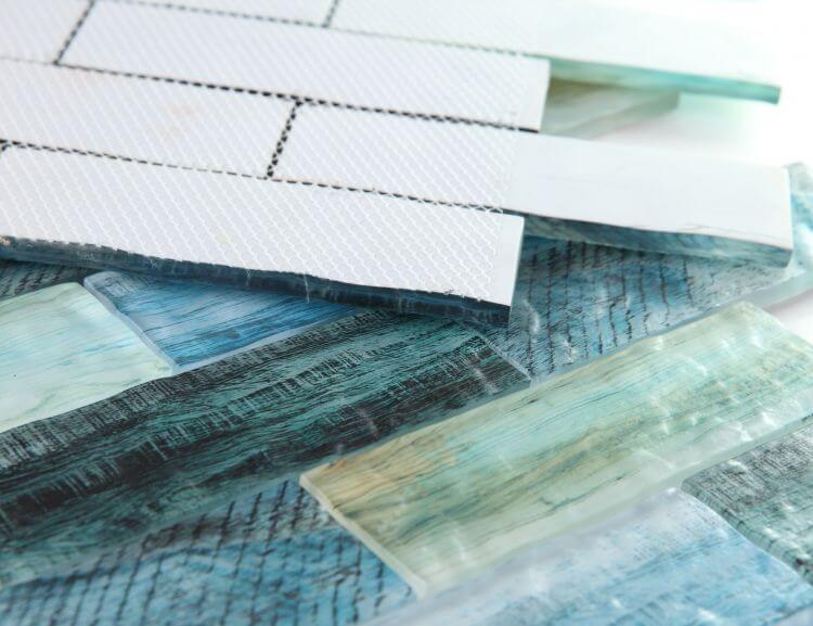 Art Wood Forest 11.75 x 11.75 glass tile mosaic showcasing blue-green linear brick pattern and textures.