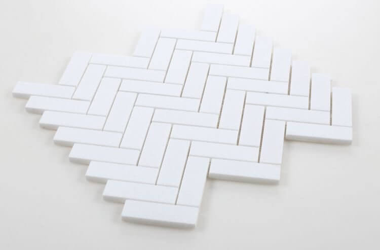 1x3 Chevron Long Thassos marble mosaic tile in a sleek white pattern, perfect for modern and elegant designs.