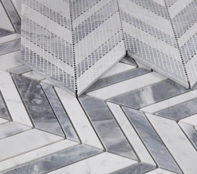 Chevron Shadow Lava mosaic in Carrara and Italian Grey marble, showcasing polished grey and white chevron and herringbone design.