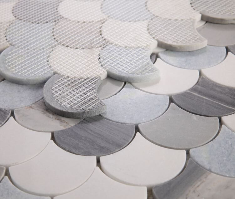 Dragon Scale Deep Ocean mosaic showcasing a polished scale pattern in shades of grey, blue, and white marble.