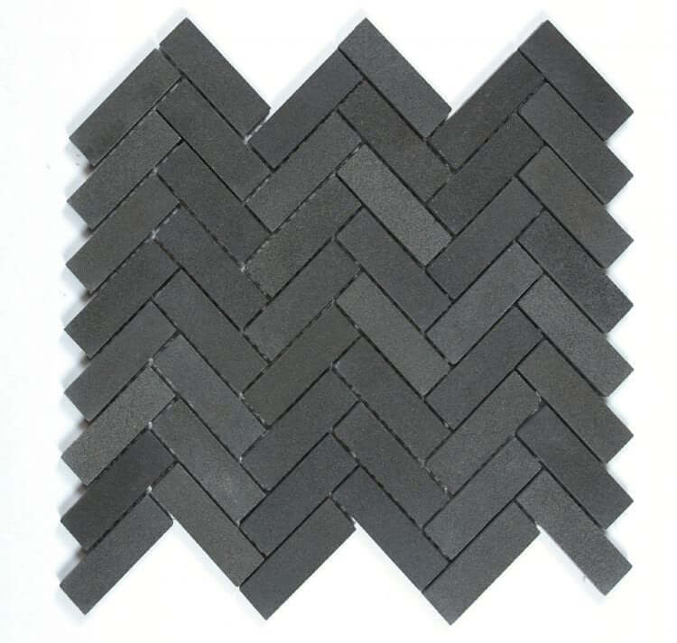 Herringbone Basalt tile in black and grey, 11x12.5 inches, showcasing a classic herringbone pattern.