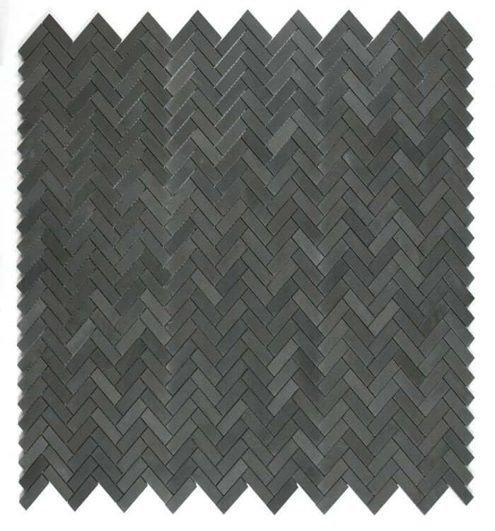 Herringbone Basalt mosaic tile 11 x 12.5 in black and grey, featuring a stylish 1x3 herringbone pattern.