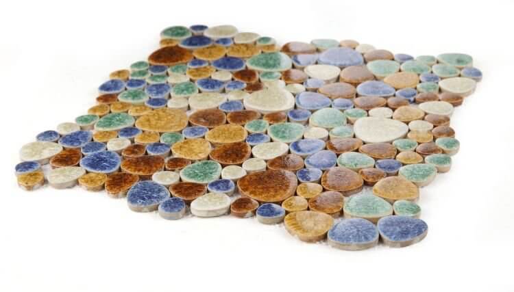 Poseidon Forest pebble mosaic tile with earthy tones of browns, tans, greens, and blues, perfect for pool areas.