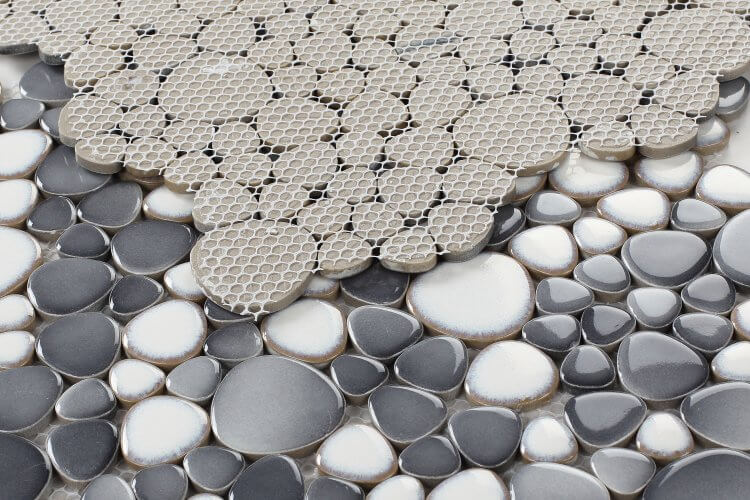 Contemporary 11.50 x 11.50 pebble mosaic tile in shades of grey and white, perfect for modern pool designs.