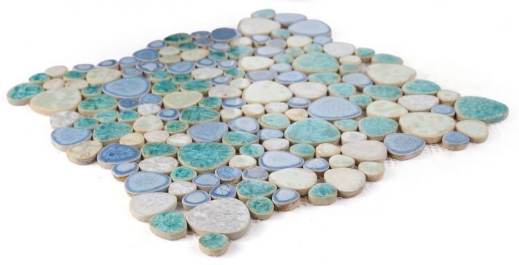 Poseidon Sea Pebble mosaic tile showcasing an assortment of smooth, colored porcelain pebbles in a contemporary design.