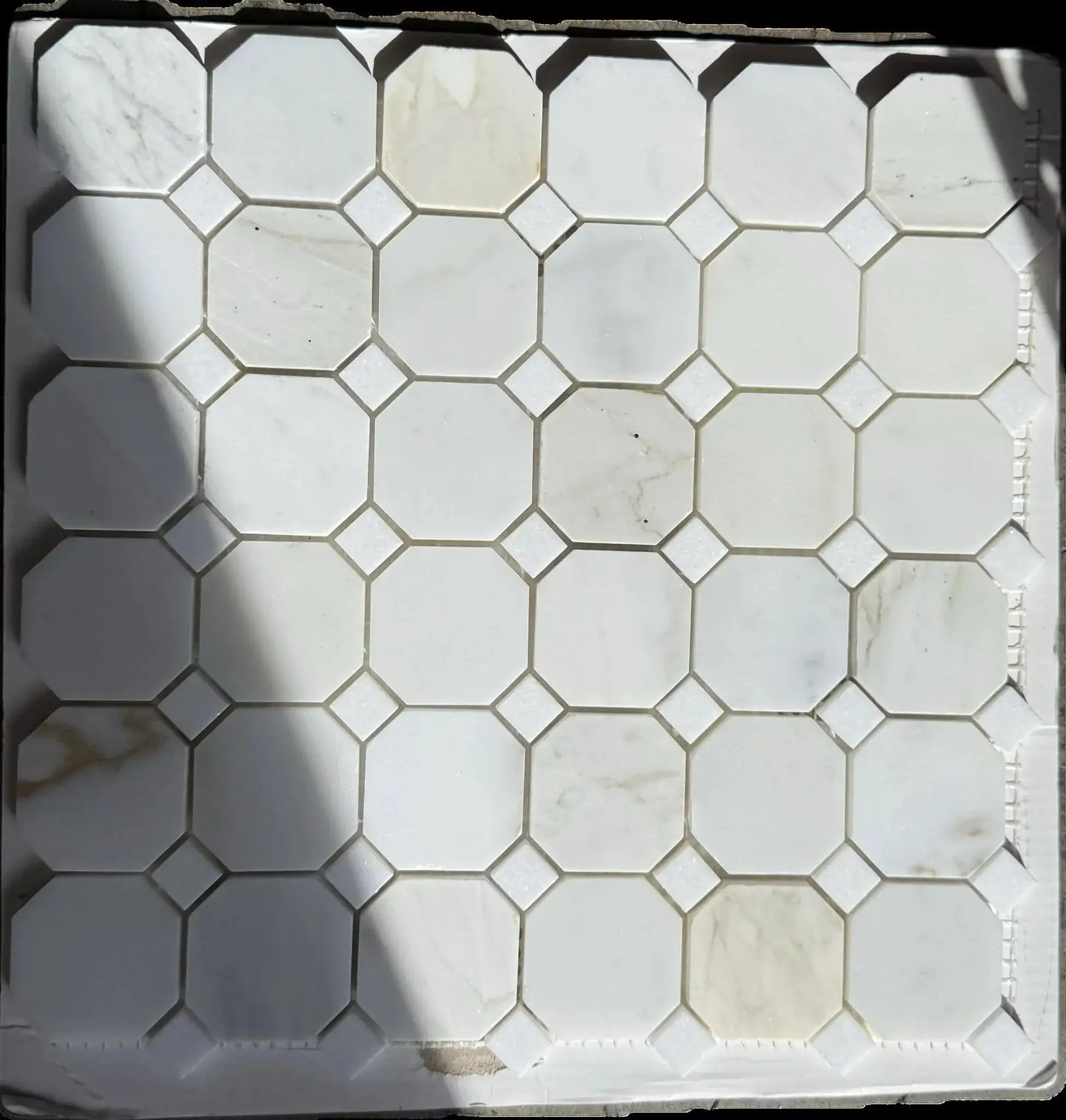 12x12 Tuscan Calacatta Gold Octagon Mosaic Tile showcasing luxury white marble with gold and grey veining.