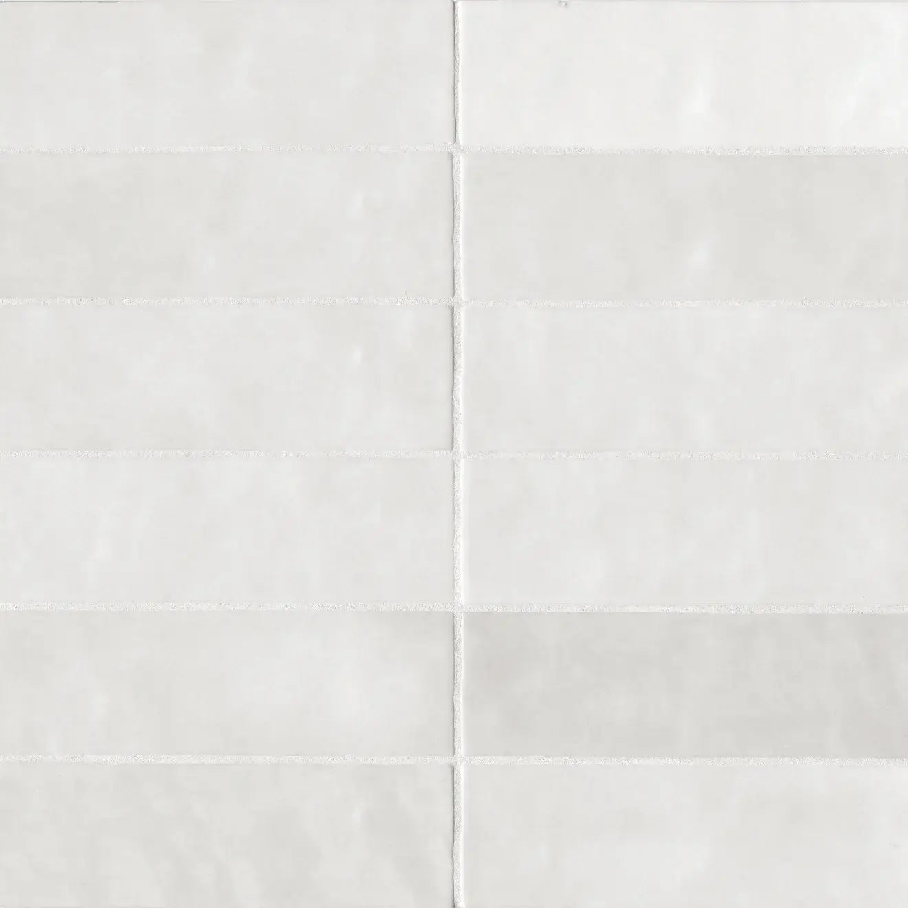 Cloé 2.5" x 8" glossy white ceramic tile, perfect for modern kitchen backsplashes and bright interiors.