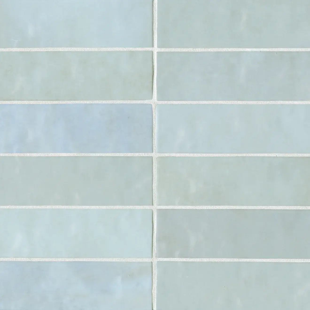 Cloé 2.5" x 8" glossy ceramic tile in baby blue showcasing a sleek rectangular pattern.