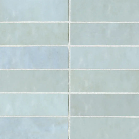 Cloé 2.5" x 8" glossy ceramic tile in baby blue showcasing a sleek rectangular pattern.