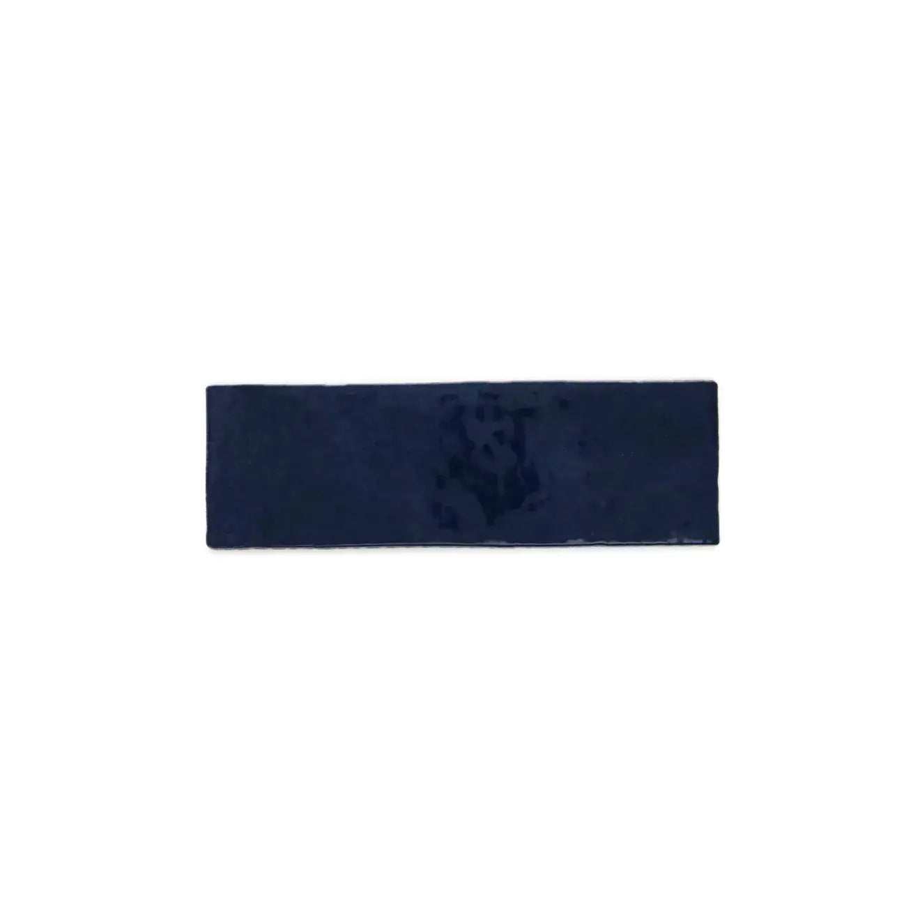 Cloé 2.5" x 8" glossy ceramic tile in vibrant blue, perfect for bold or serene interior designs.