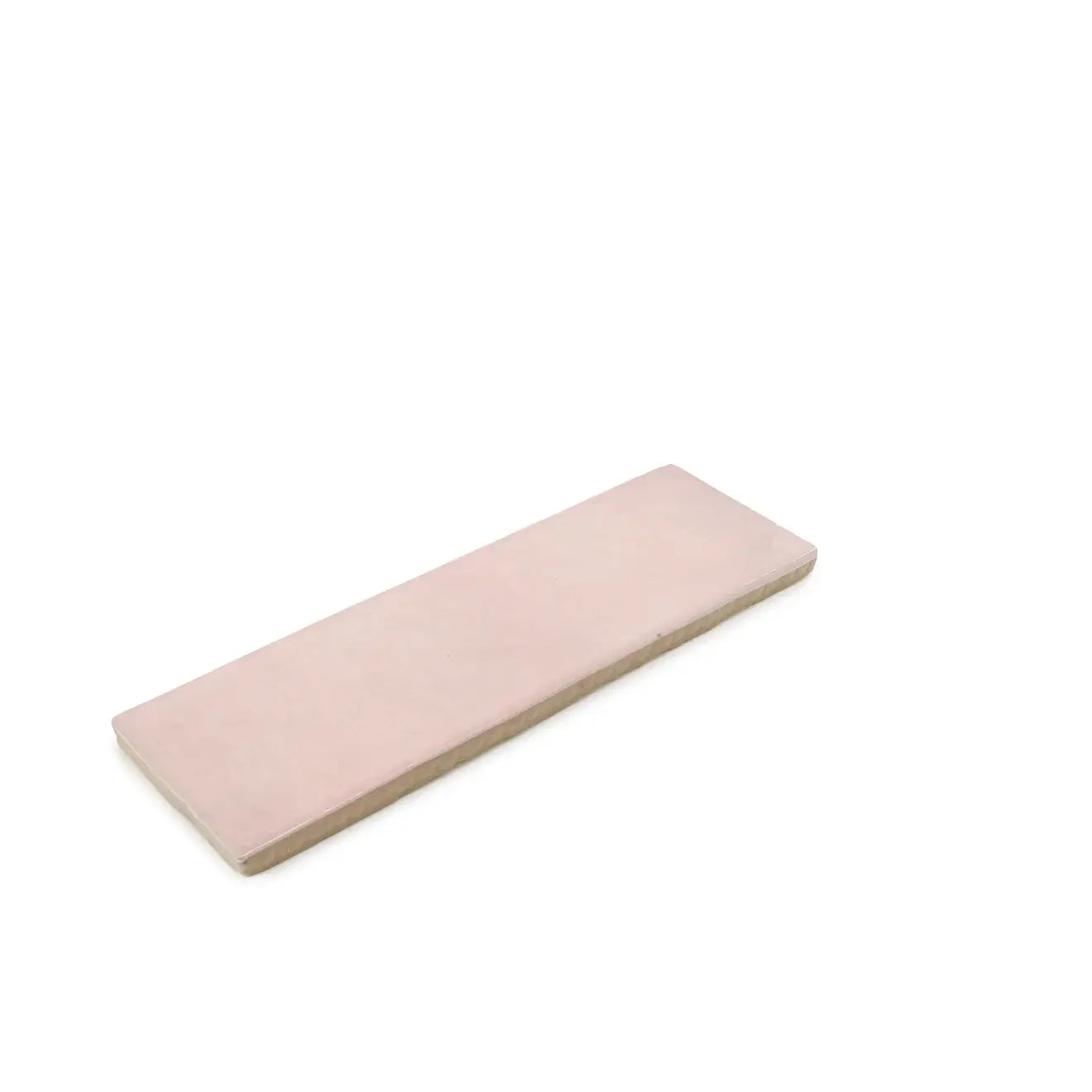 Cloé 2.5x8 glossy pink ceramic tile against a white background, perfect for stylish home decor.