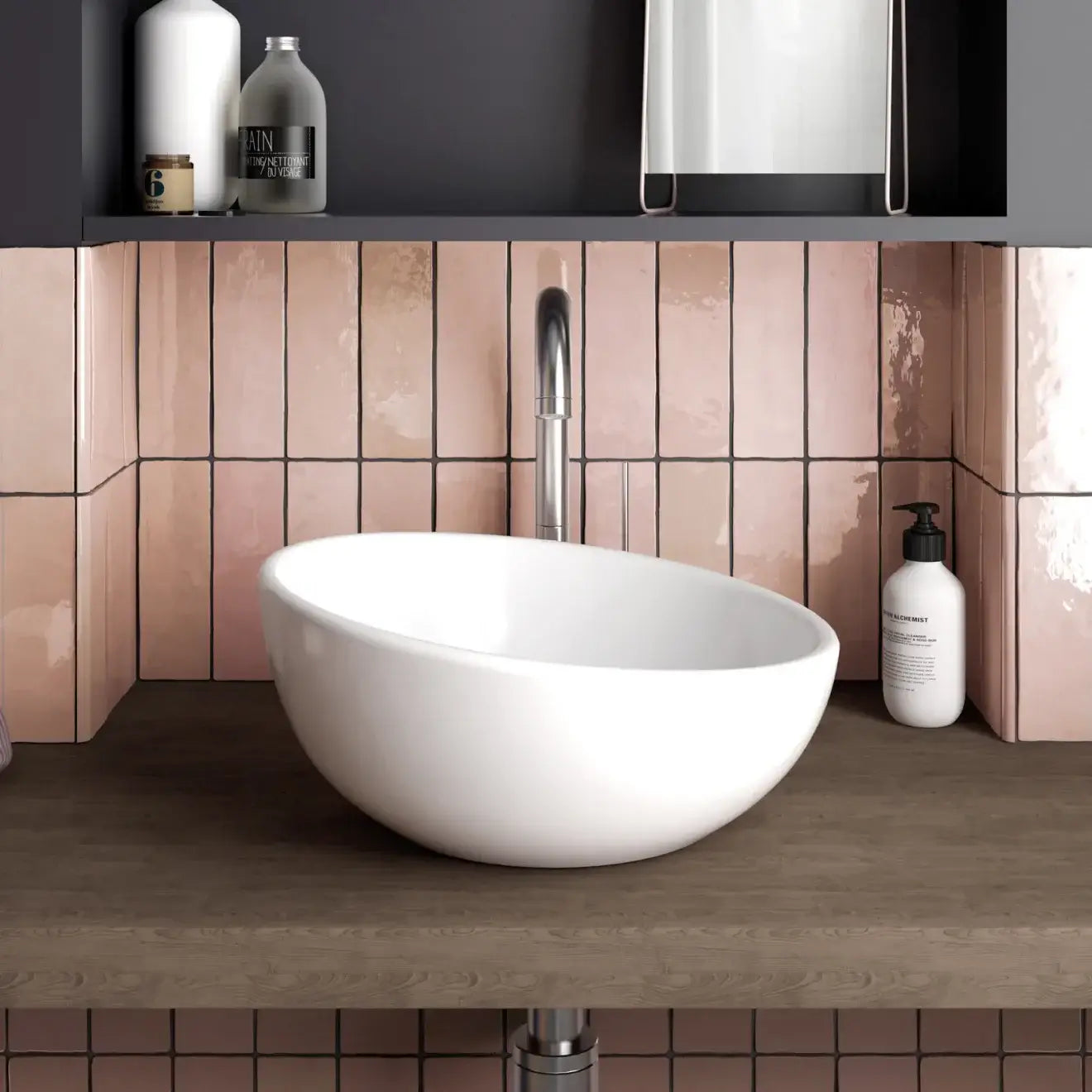 Modern bathroom with white bowl sink and Cloé pink glossy ceramic tile backsplash.