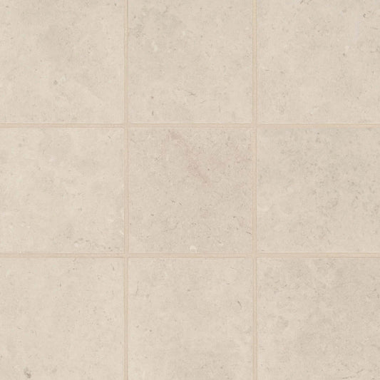 Thaddeus 4x4 matte porcelain mosaic tile in soft creme color, perfect for backsplashes and shower floors.
