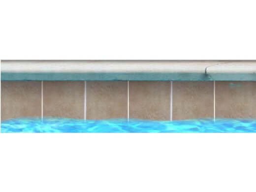 Fujiwa Tan 6x6 Pool Tile showcasing durability and style against a beautiful blue water backdrop.
