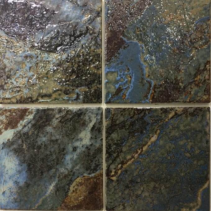 Close-up of 6"x6" porcelain tile with a rich blend of blue and green hues, perfect for stylish poolscapes.
