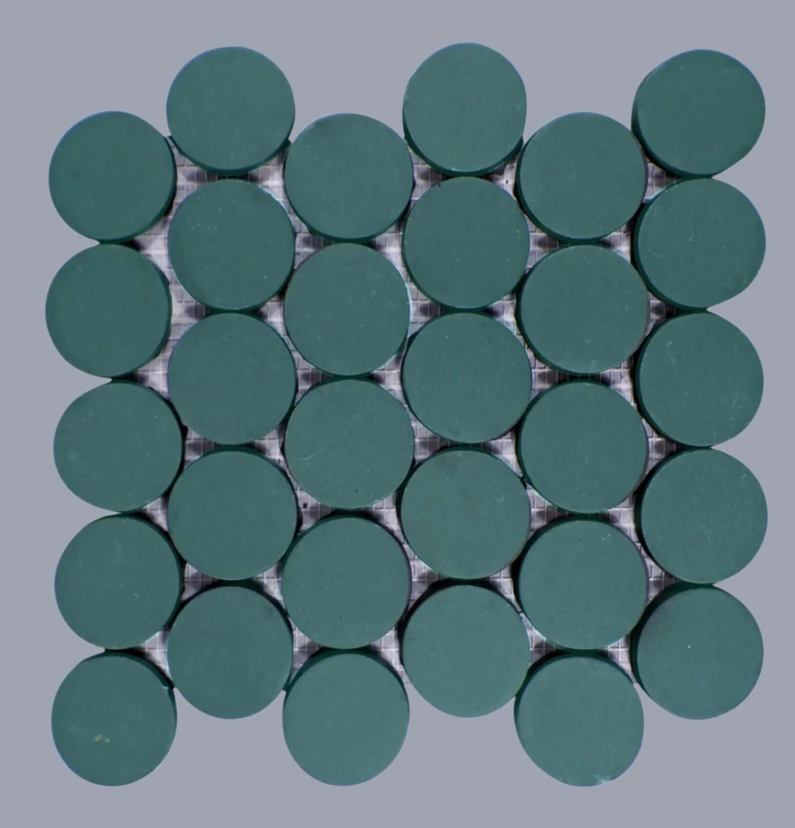 Makoto 2-inch round matte porcelain mosaic tiles in Midori Green, arranged in a grid pattern.