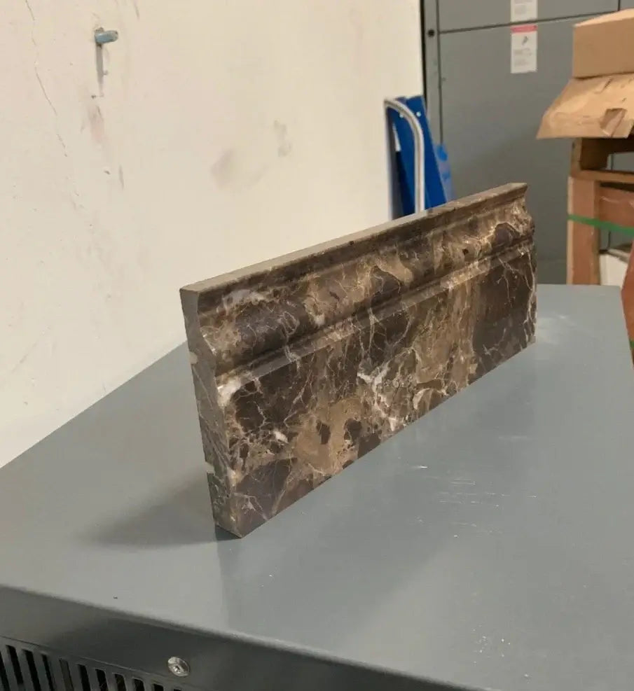 Iberian Emperador Dark marble baseboard skirting molding, showcasing rich brown hues and striking veining.