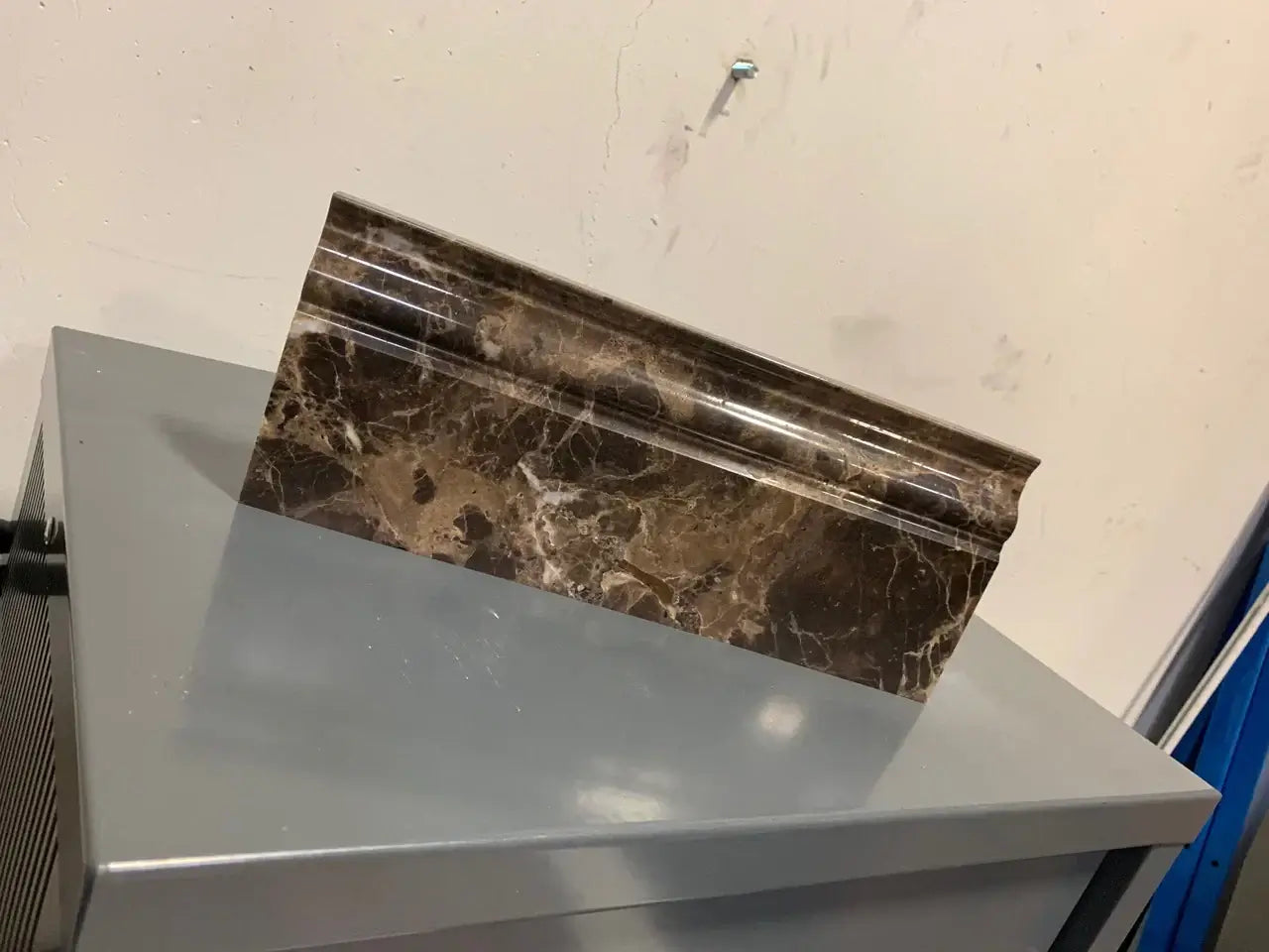 Iberian Emperador Dark baseboard skirting molding, showcasing rich brown marble with light veining, perfect for elegant interiors.