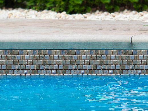 Fujiwa Joya Series 1x1 Albi Blue tiles displayed around a pool, enhancing its vibrant and stylish look.