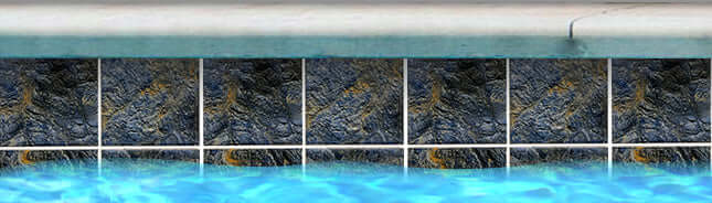 Santa Barbara Blue porcelain tiles lining a pool, showcasing vibrant colors and texture for a stunning poolscape.