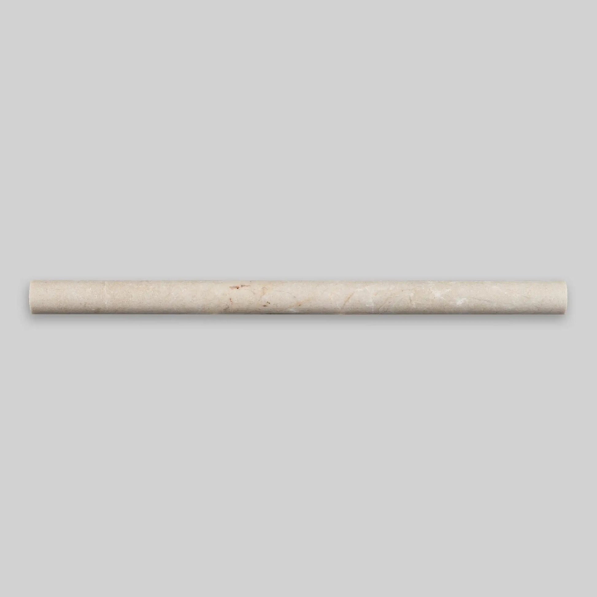 Polished Spanish Crema Marfil marble pencil liner, 1/2 x 12 inches, ideal for elegant tile borders and design accents.