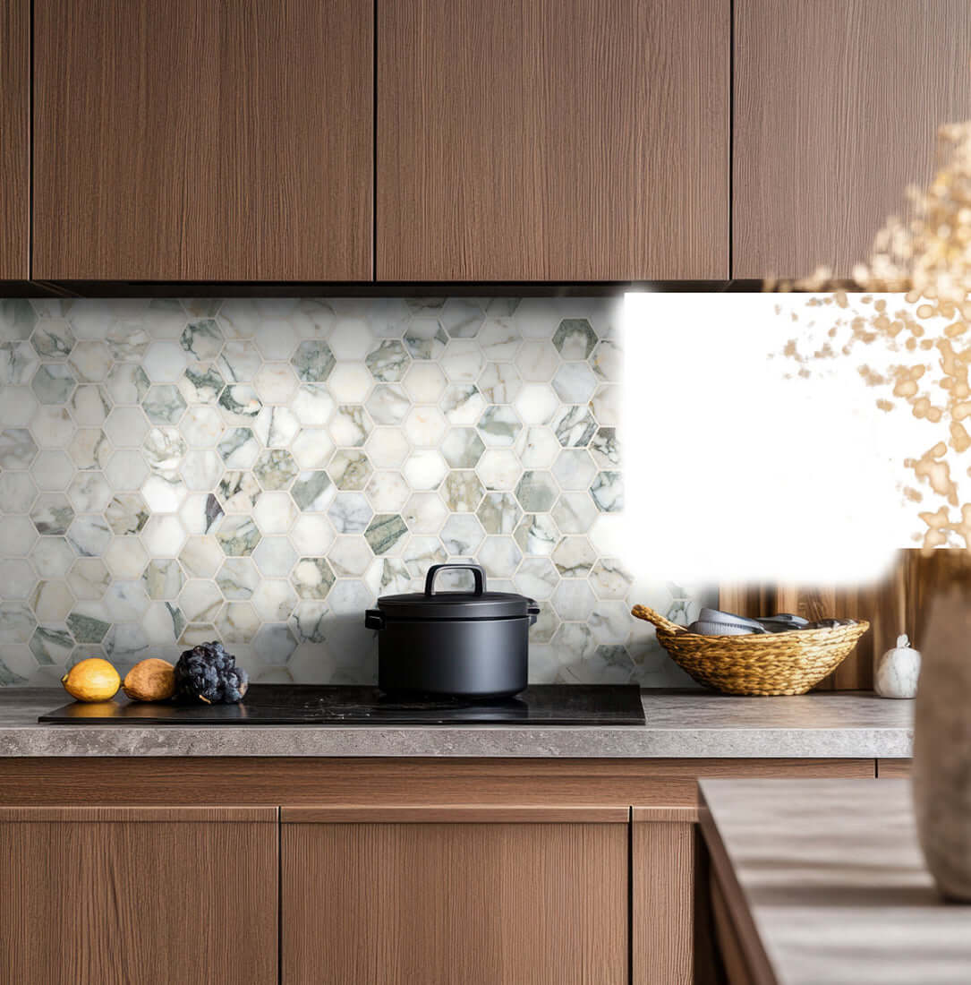 2-inch Calacatta Green marble hexagon honed mosaic tile backsplash in modern kitchen with cooking pot and decor.