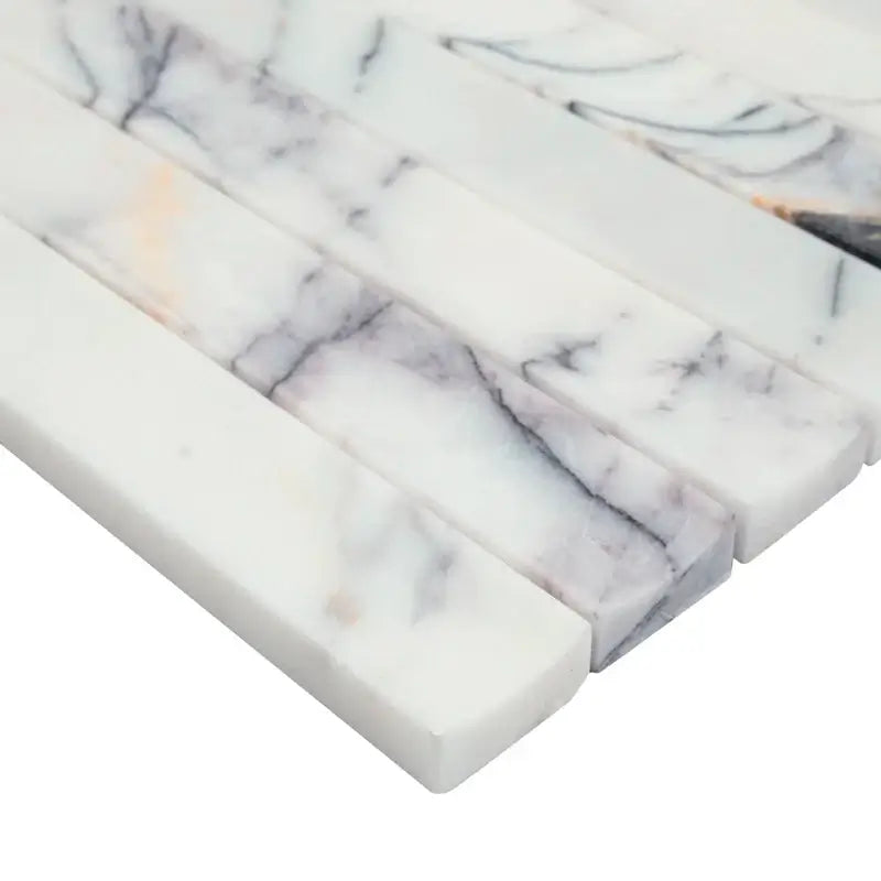 Calacatta Viola Lilac honed marble mosaic tiles showcasing elegant curves and textures in a scallopini pattern.