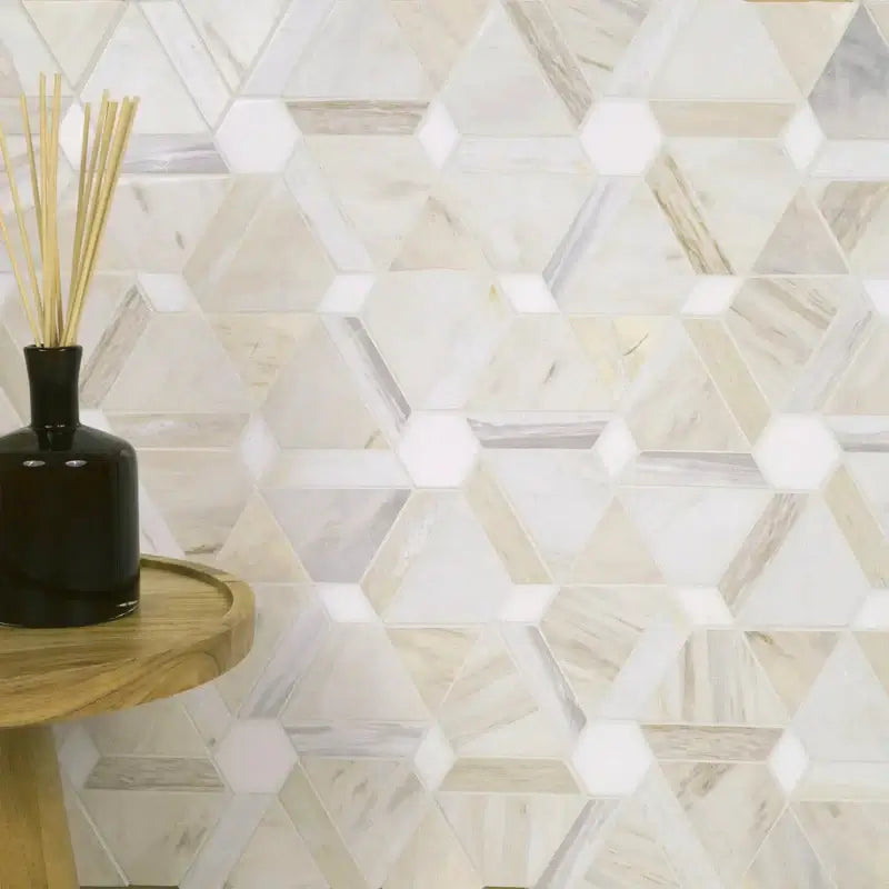 Angora Floralis polished marble mosaic tile with floral design, displayed on a wall beside a decorative vase.