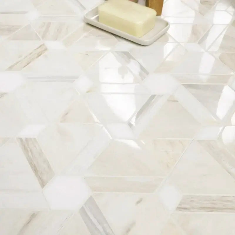 Hexagonal marble tile flooring with a polished finish and soft lighting, showcasing elegant design and texture.