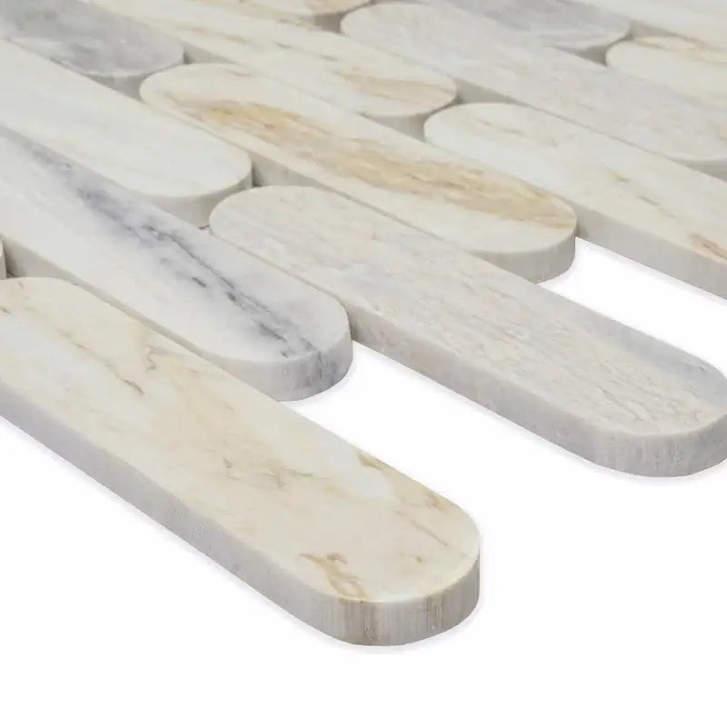 Angora Ellipse polished marble mosaic tiles showcasing a contemporary oval design in various shades of natural stone.