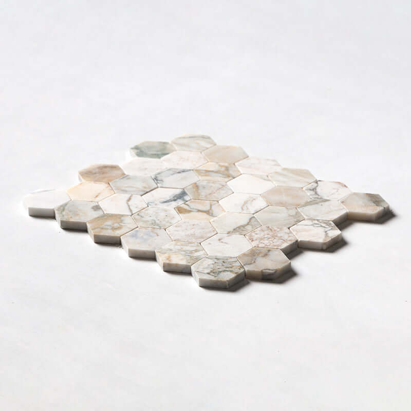 2-inch hexagon marble mosaic tile in soft beige and white tones, perfect for elegant interior designs.