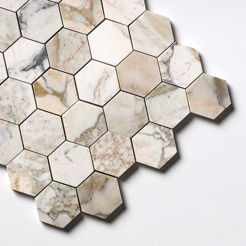 Honed hexagon marble mosaic in shades of white and beige, perfect for elegant interior design.
