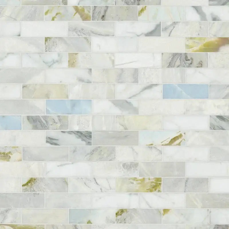 Cloudland 2x6 Polished Marble Subway Mosaic Tile showcasing elegant veining and a cool white base in shades of blue and gray.