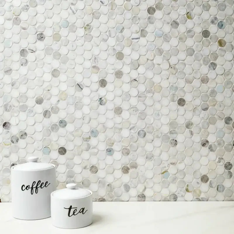 Cloudland polished marble mosaic tile wall with round pattern and white canisters labeled coffee and tea.