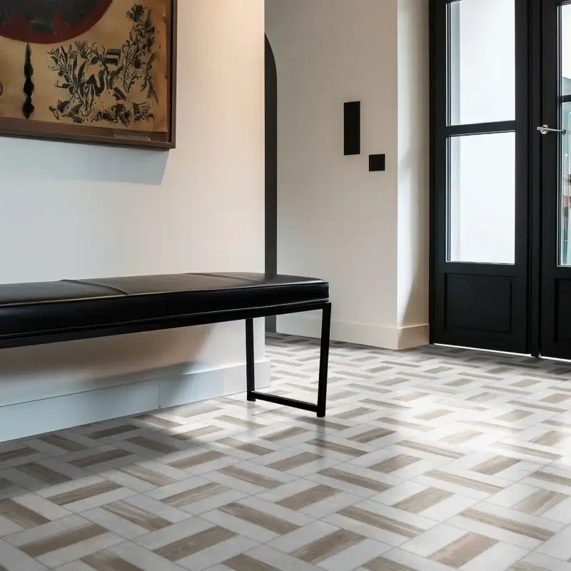 Modern interior featuring Winslow Weave polished marble mosaic tile on the floor with a sleek black bench.