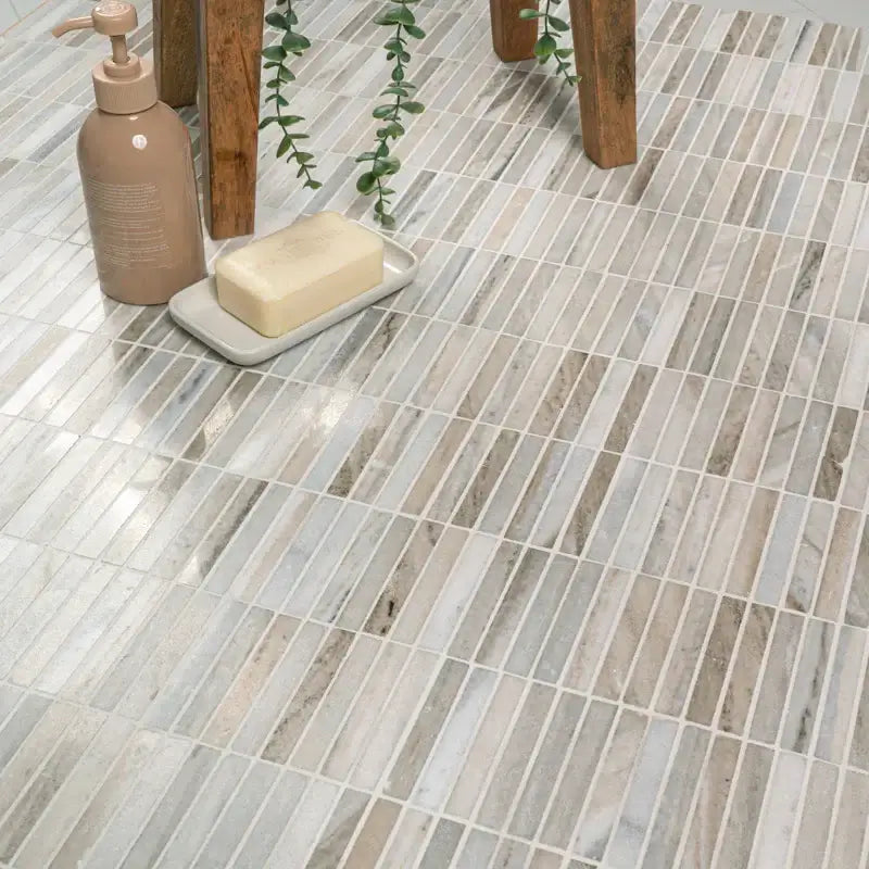 Ravello Mini Stack honed marble mosaic tile flooring with natural stone in contemporary design, featuring decorative elements.