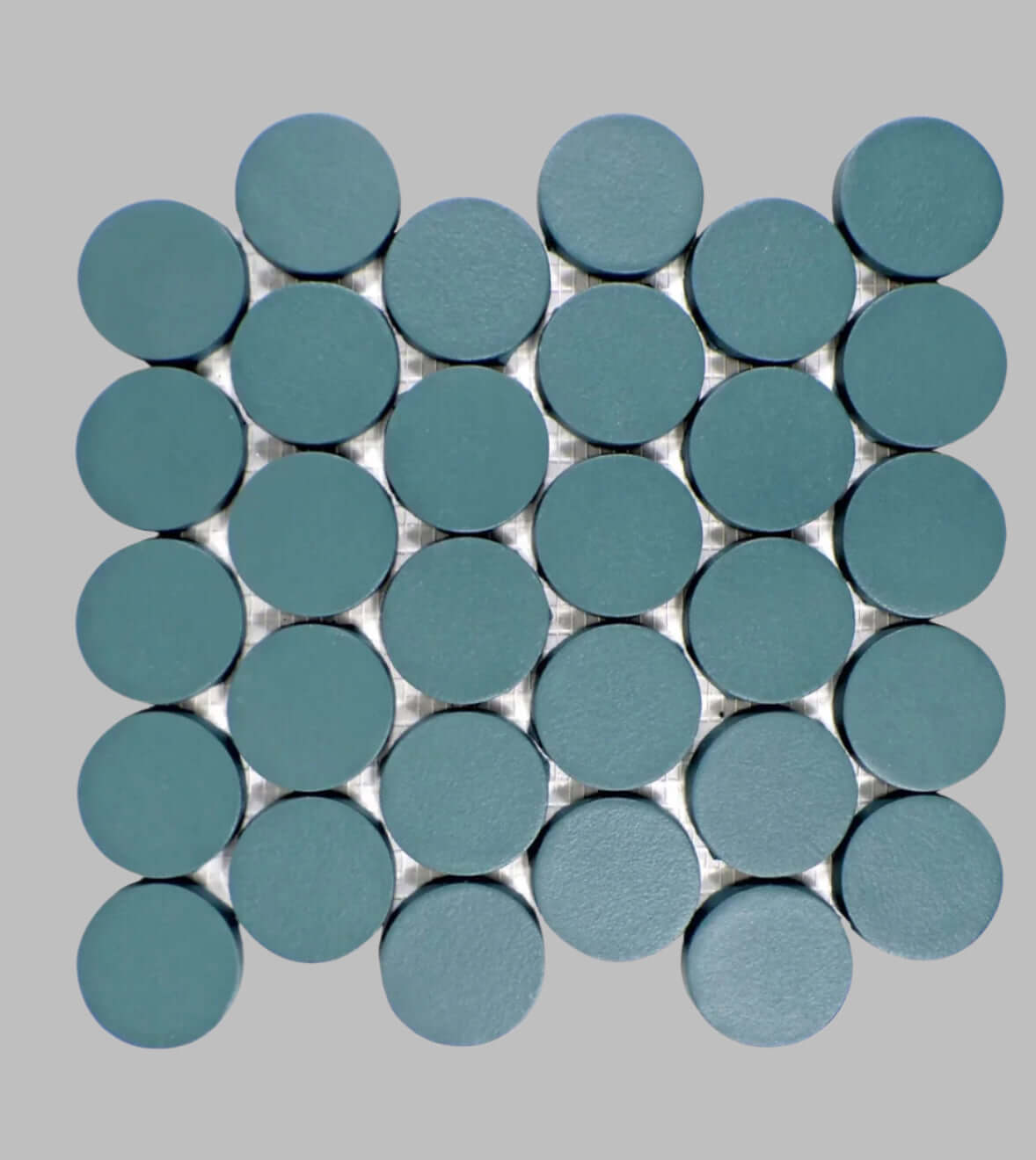 Makoto 2" round matte porcelain mosaic tile in Arashi Blue for unique wall and floor designs.