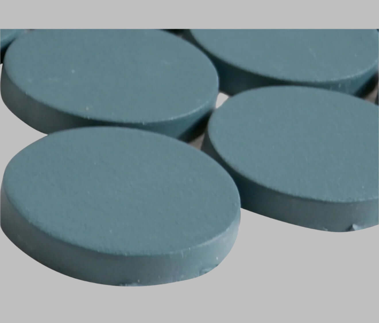 Makoto 2-inch round matte porcelain mosaic tiles in Arashi Blue, showcasing a calming blue color and circular design.