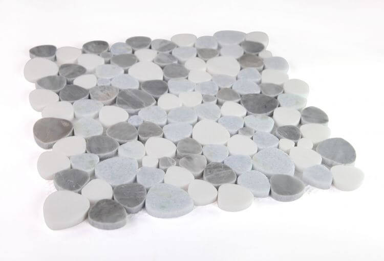 Aphrodite Blue Ocean 12x12 ceramic tile featuring a mix of gray and white pebble shapes for versatile design.