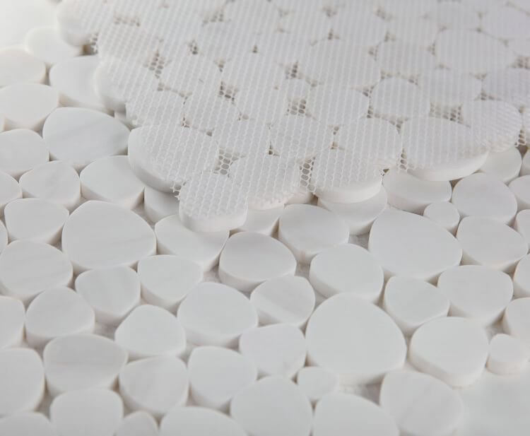 Aphrodite Dolomite Honed Mosaics showcasing heart-shaped white marble tiles arranged in a beautiful pattern.