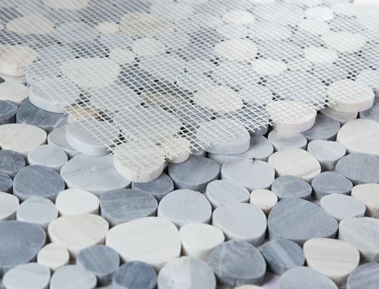 Aphrodite Italian Blue mosaic tiles featuring heart-shaped Palissandro Blue Marble, showcasing a pebble design.