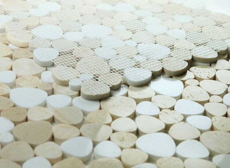 Close-up of Aphrodite Marfil 12x12 mosaic tile featuring polished heart-shaped marble pieces in white and beige.