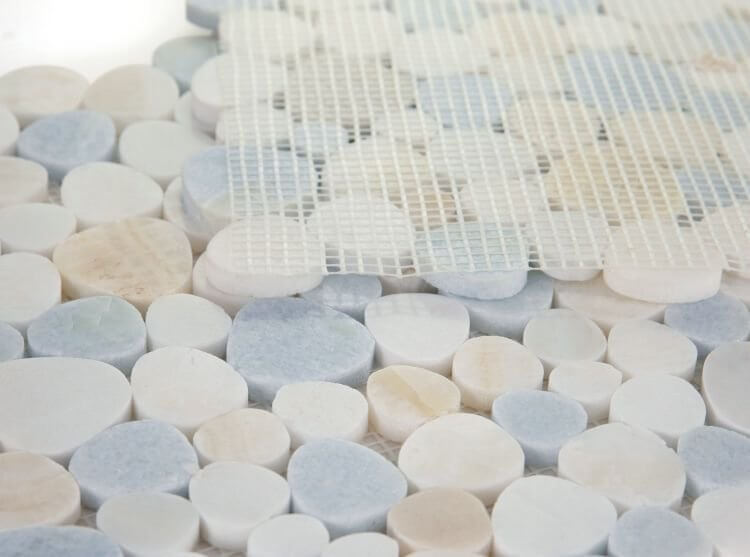 Aphrodite Marina mosaic tiles featuring polished white and blue marble pebbles in various shapes and sizes.