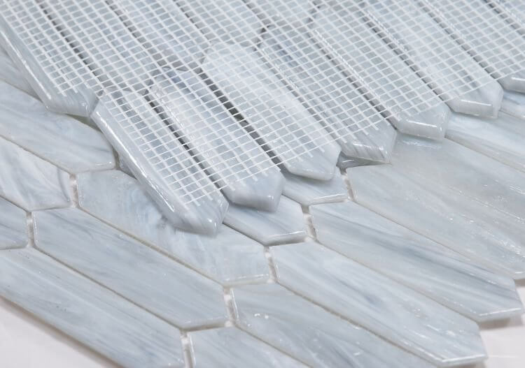 Arrow Grey 10.25x12.5 through-body glass mosaic featuring elongated hexagon tiles.