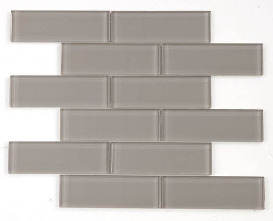 Polished grey glass tile in subway layout, 2x6 chip sizes, perfect for swimming pool installations.