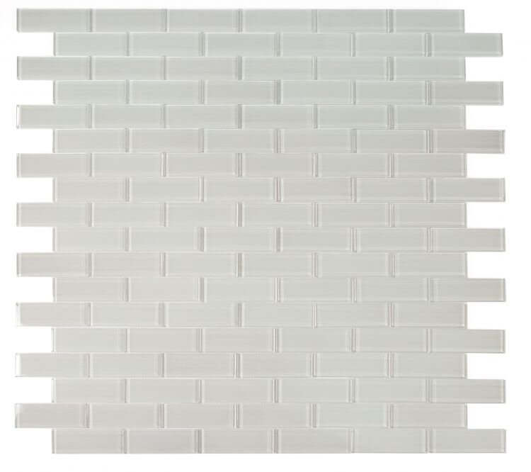Casale Light 11.75 x 11.75 polished light grey glass tiles in subway layout for swimming pool installation.